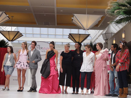 Group picture of the three competing teams with their garments and models  